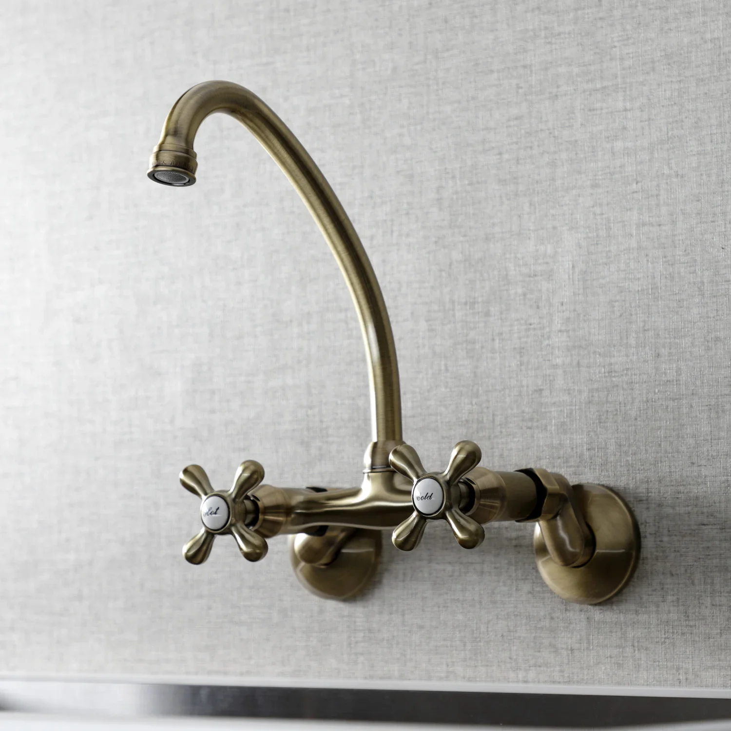 Kingston Brass Kingston Double-Handle Wall-Mount Bridge Kitchen Faucet, Antique Brass (KS214AB) - Image 3